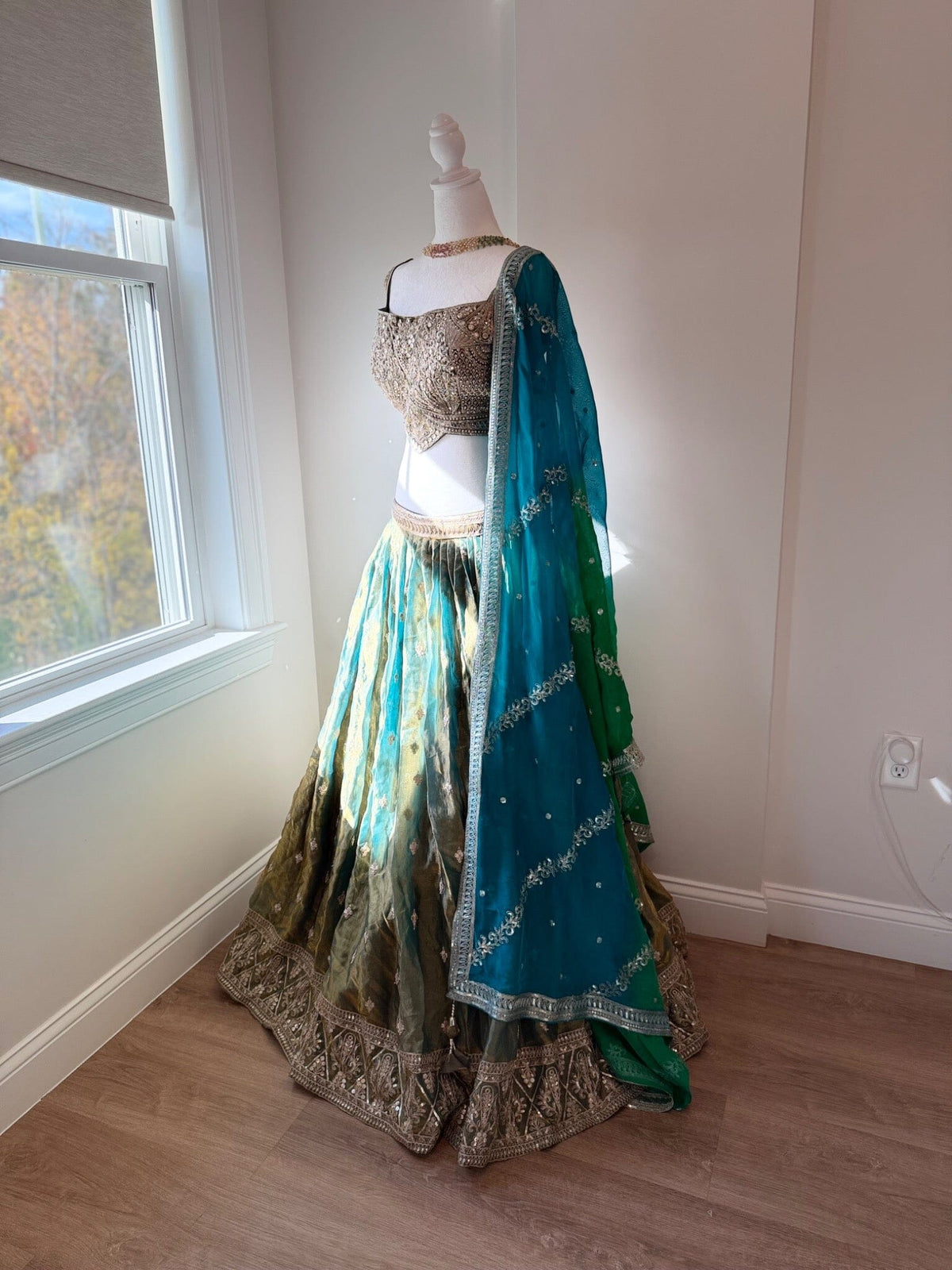 Original garment view of aqua and antique gold lehenga with embellished blouse and teal green dupatta