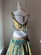 Original garment view of aqua and antique gold lehenga with embellished blouse and teal green dupatta