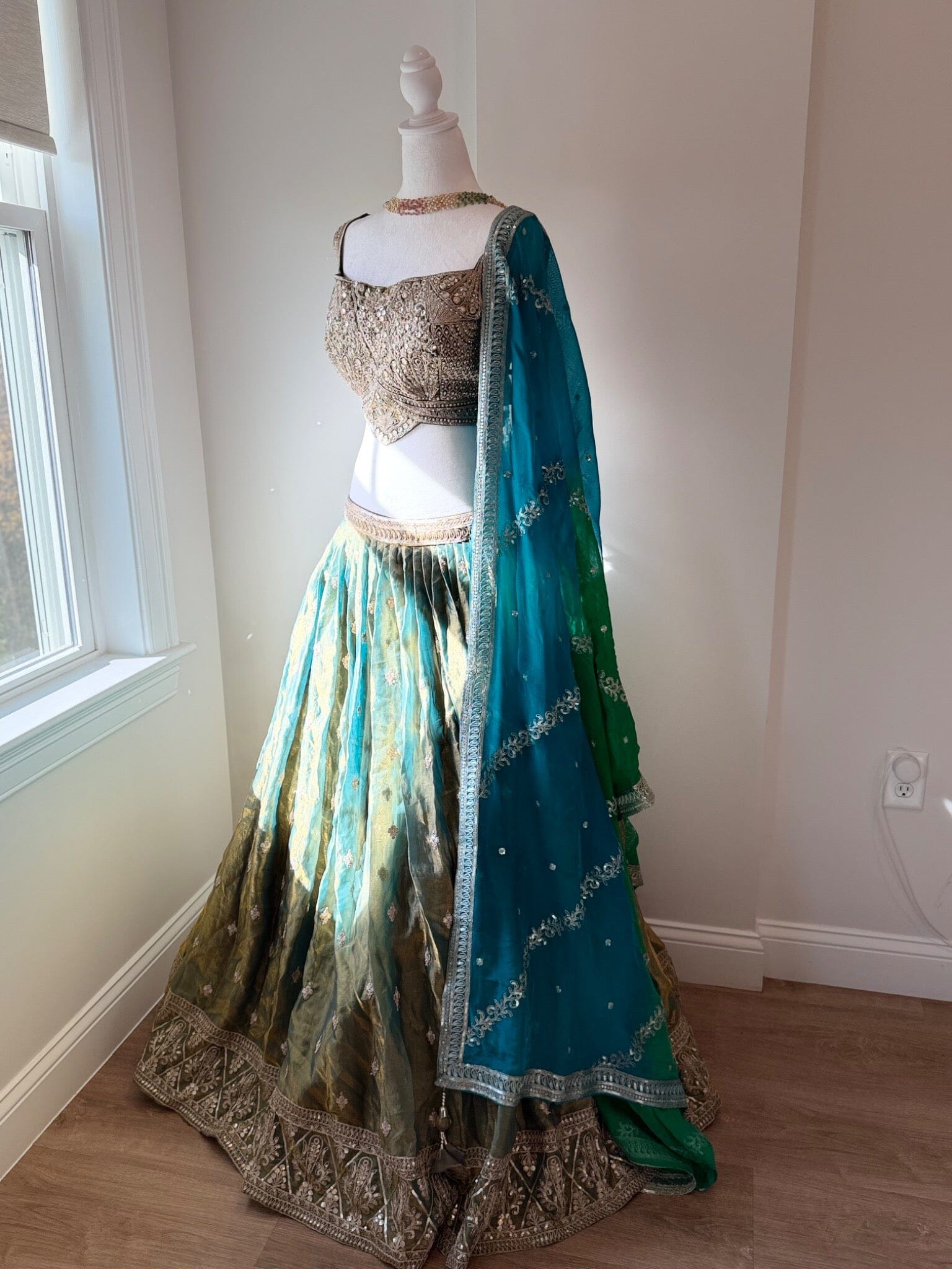 Original garment view of aqua and antique gold lehenga with embellished blouse and teal green dupatta