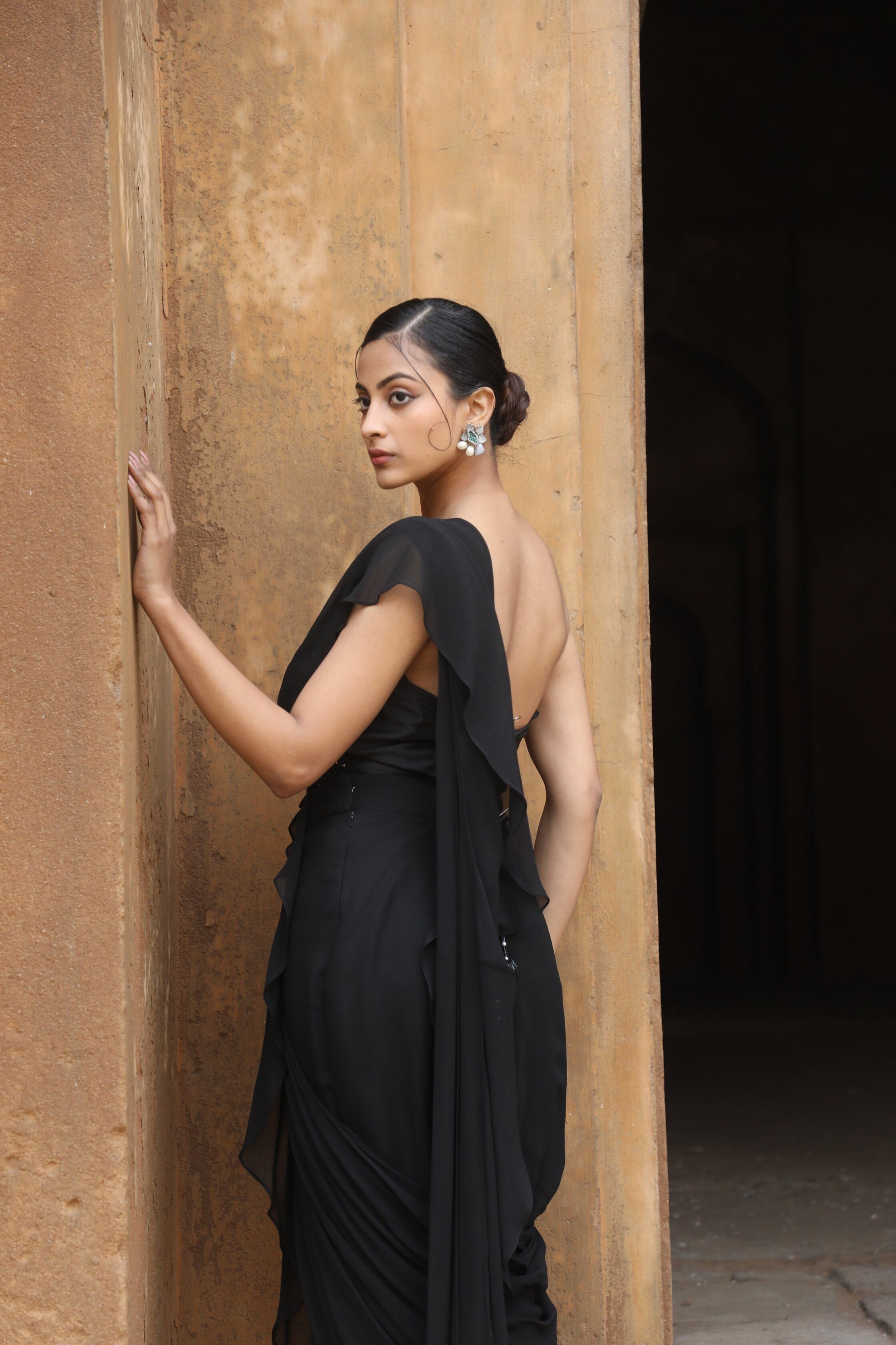 Sabyasachi - Romantic power dressing in a jet black saree. The lavish  blouse is hand-embroidered on black tulle with vintage threadwork and  appliqué, mimicking an eighteenth century Parisian tapestry featuring  European flora