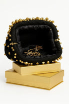Blair black fabric statement clutch with gold stud embellishments