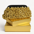 Blair black fabric statement clutch with gold stud embellishments