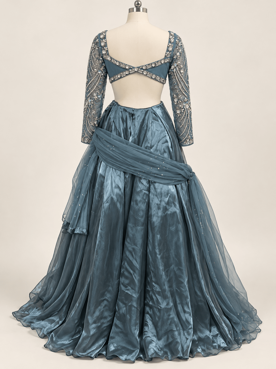 Back mannequin view of slate blue crystal embellished lehenga rental set