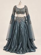 Front mannequin view of slate blue crystal embellished lehenga rental set