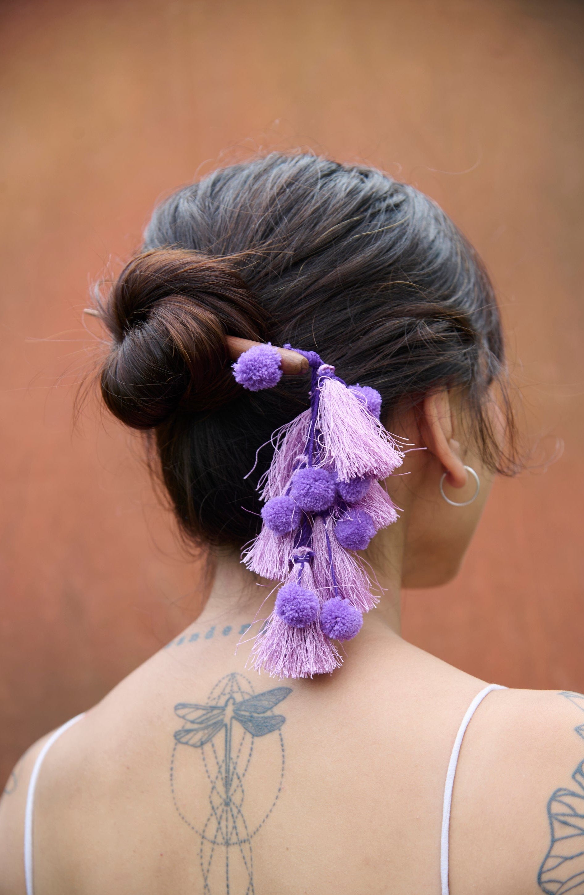 Stylish Man Bun with Sticks: Fashion Forward Accessory Trend